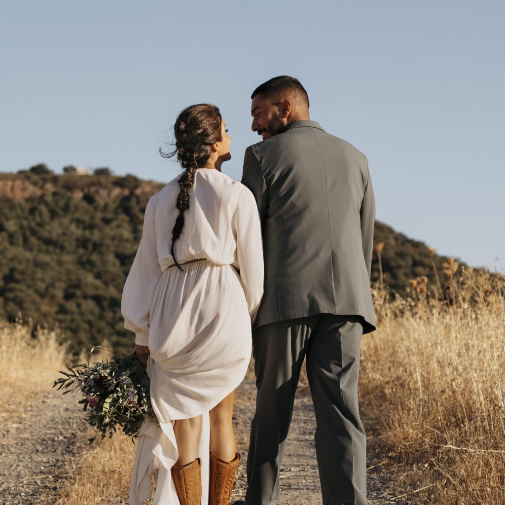 Coloured Couple walking along a path outside at their wedding after completing their Pre Marital Counselling Program